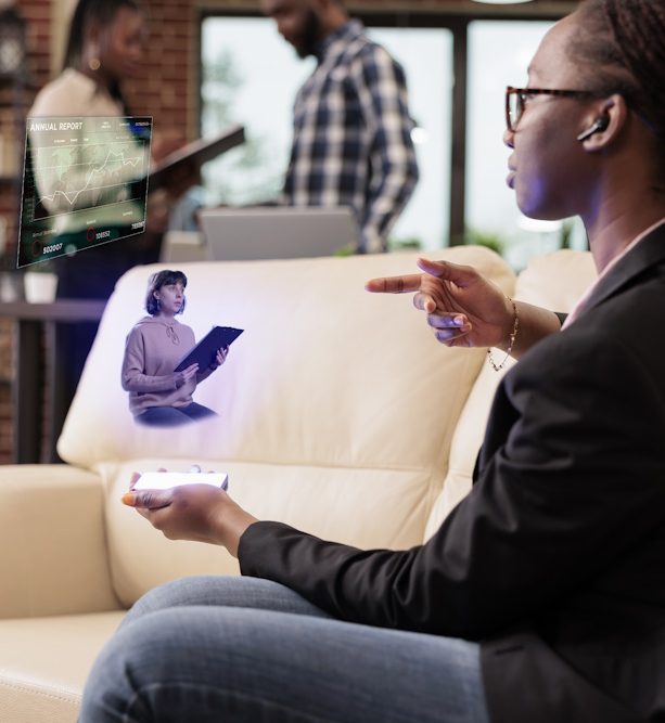 Startup worker talking to ai hologram, using artificial intelligence and augmented reality to chat with manager. Working with holographic tech concept in business company office.